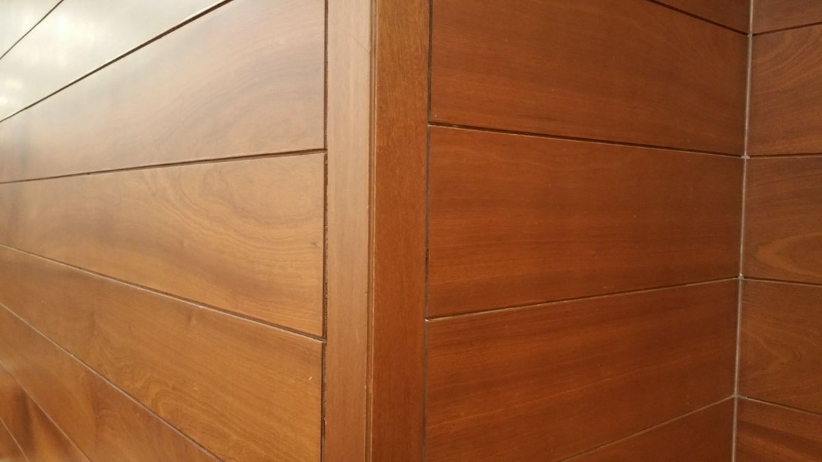 Stock close-up of wood wall panels with visible grain and horizontal joints