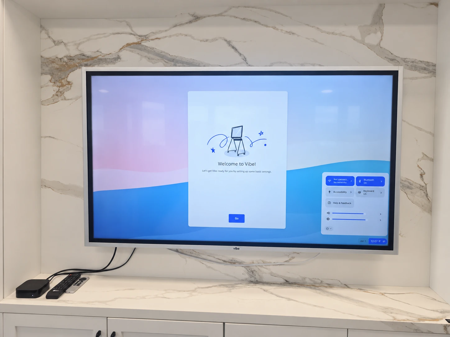 Wall-mounted Vibe interactive board above a stone-look countertop